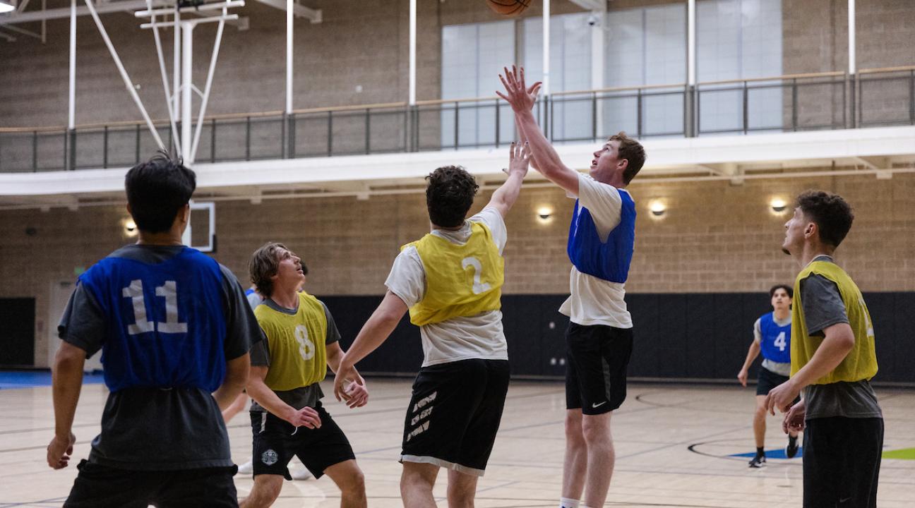 students playing basketball