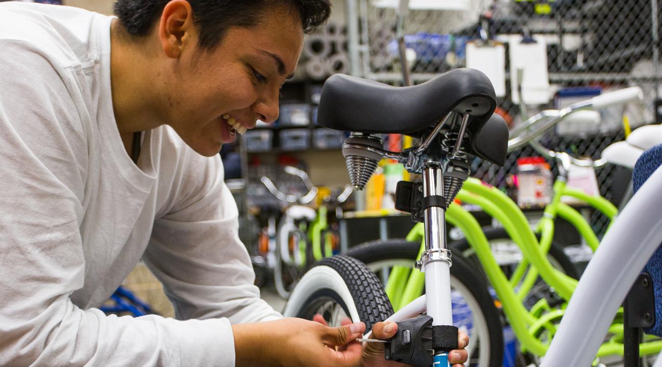Student fixing bike