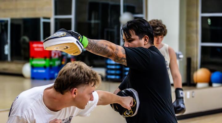 Group Fitness Class two individuals boxing
