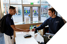 a student checking in at the rec center front desk