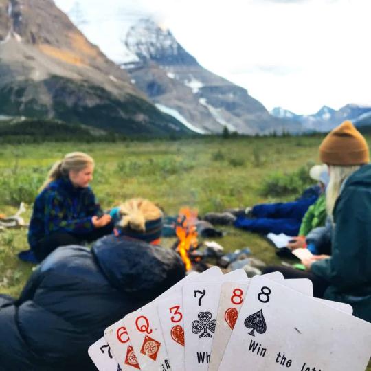 people playing card games at a campground