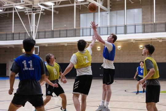 students playing basketball