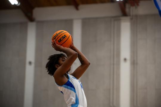 student shooting a free throw