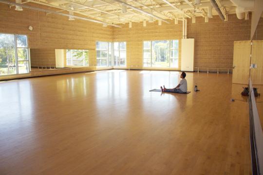 inmotion instructor sitting in studio 