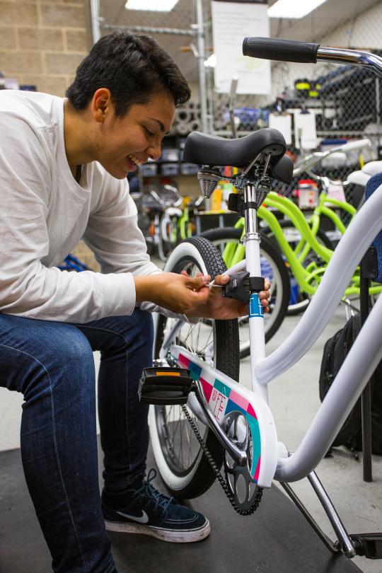 Student fixing bike