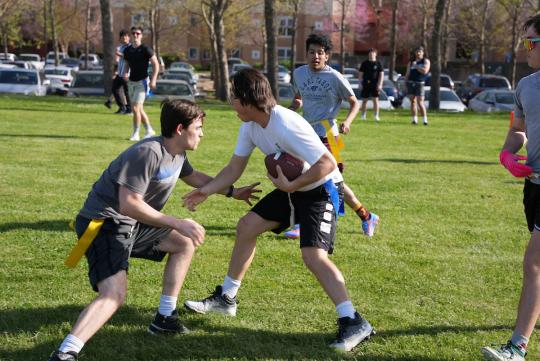 students playing flag football